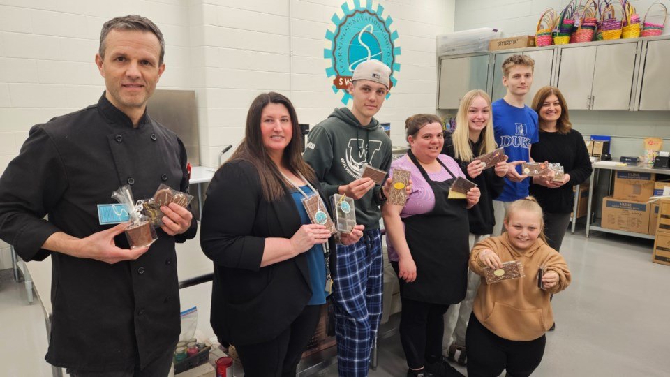 Group shot ADmin and students in kitchen